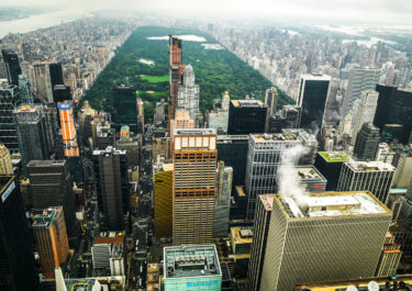 photography with the title 'NYC Rooftops 7'. Capture of Midtown Manhattan, with the Central Park in the Background.