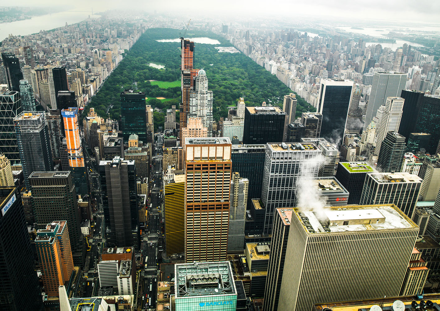 photography with the title 'NYC Rooftops 7'. Capture of Midtown Manhattan, with the Central Park in the Background.