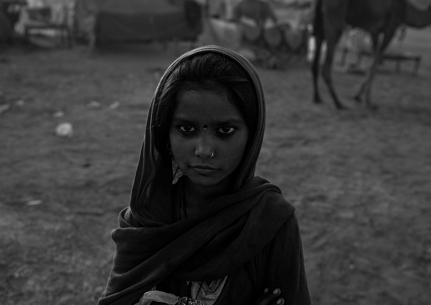 Black and white photography with the title 'India 15'. Portrait of a young Indian Girl with a headscarf.